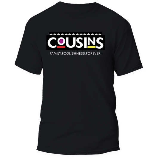 A black short-sleeve t-shirt with a graphic on the chest reading 'COUSINS' in white letters over a black bar, with a small red and yellow accent and the phrase 'FAMILY-FOOLISHNESS FOREVER.' underneath, shown on a plain white background.